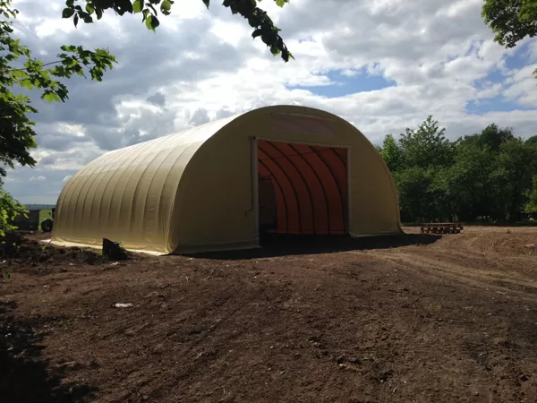 Gable with raisable door and roll-up system